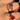 models hand showcasing a collection of gold and colourful gemstone rings