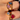 models hand showcasing a collection of gold and colourful gemstone rings