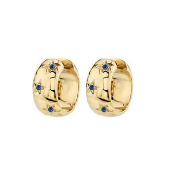 Gold hoop earrings with blue gemstones on a white background