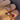 models hand showcasing a collection of gold and colourful gemstone rings