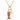 Gold necklace with a red fish charm and diamond pendant on a white background