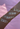 Bracelets with names on a blurred pink background