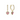 Gold heart-shaped earrings with pink gemstones on a white background
