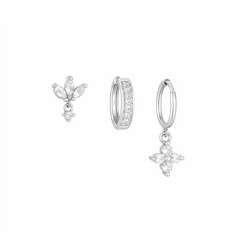 Set of silver earrings on a white background