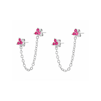 Silver chain earrings with pink clovers embellished in the earrings placed on a white back ground