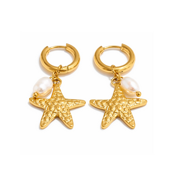 Gold hoop earrings with starfish and pearl charms on a white background