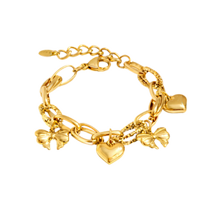 Gold charm bracelet placed on a white background