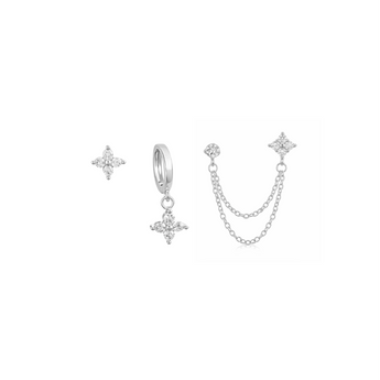Set of silver clover-shaped earrings on a white background