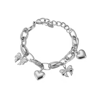 A silver charm bracelet featuring a mix of link styles and dangling charms, including two bow charms, two heart charms, and a textured oval charm, displayed on a clean white background.