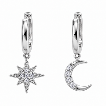 A pair of silver huggie hoop earrings with dangling celestial charms. One charm is a starburst pavé-set with clear cubic zirconia, and the other is a crescent moon with a single row of clear pavé-set stones, shown against a plain white background.
