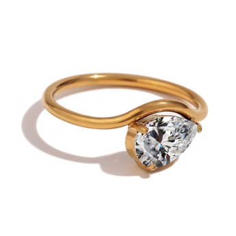 Gold ring with a heart-shaped diamond on a white background