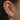 close up of ear with sliver and pink earrings