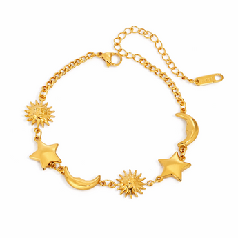 Gold bracelet with star and moon designs on a white background