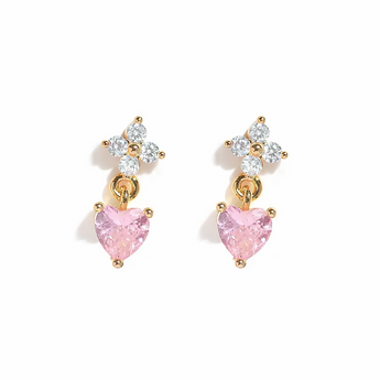 Pair of earrings with pink heart-shaped stones on a white background