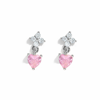 Pair of earrings with pink heart-shaped stones on a white background