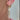 A woman with gold earrings and a chain, emphasizing her fashionable look and sophisticated jewelry choices.