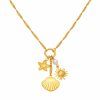 Gold necklace with shell, starfish, and sun charms on a white background