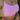 Woman wearing layered gold and diamond jewellery including a heart pendant necklace, tennis choker, pink crop top and stacked bangles, styled with a straw bag.