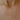 Stylish gold necklace with three shimmering diamonds set in a row.