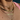Close-up of necklaces with a cross and name pendant.