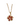 Gold chain necklace with a flower-shaped pendant. The pendant features six red gemstone petals, diamond accents, and a central diamond, conveying elegance.