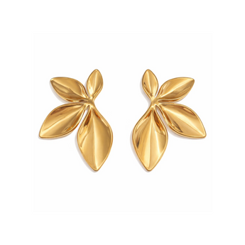 Pair of gold leaf-shaped earrings on a white background
