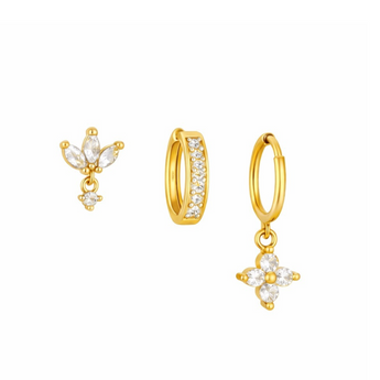 Gold hoop earrings with floral designs on a white background
