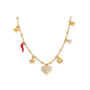Gold necklace with various charms on a white background