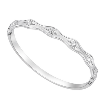 A polished silver bangle bracelet featuring a wavy outer edge adorned with small starburst motifs set with clear round-cut stones, shown on a plain white background.
