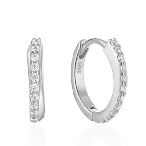 Silver hoop earrings with embedded stones on a white background