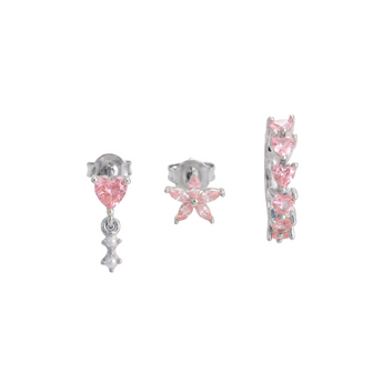 Set of pink and silver earrings on a white background