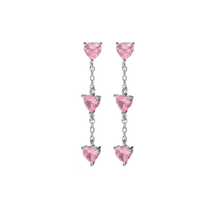 Silver stud earrings placed on a white background