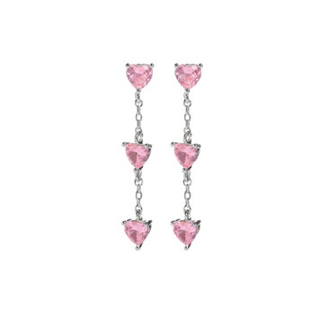 Silver stud earrings placed on a white background