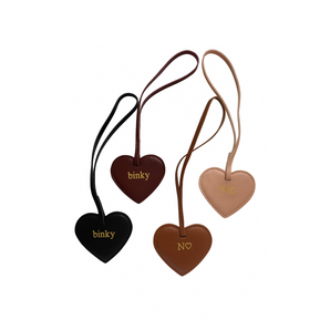Heart-shaped keychains with 'binky' and 'N' branding on a white background
