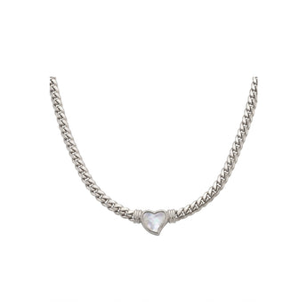 Silver chain necklace with a clear pendant on a white background