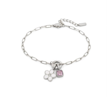 Silver bracelet with a heart and flower charm on a white background